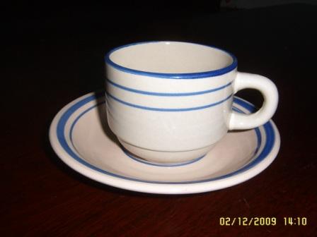 hand painted stoneware cup and saucer
